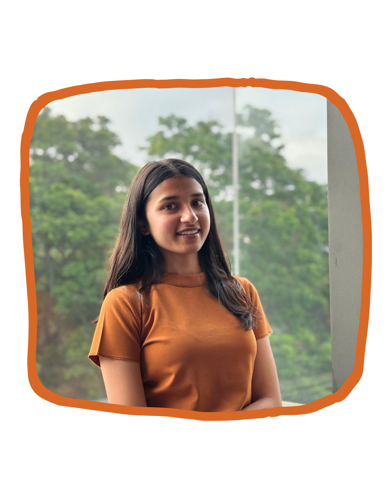 Portrait of Ayushi Shah, digital marketing expert, smiling in an outdoor setting